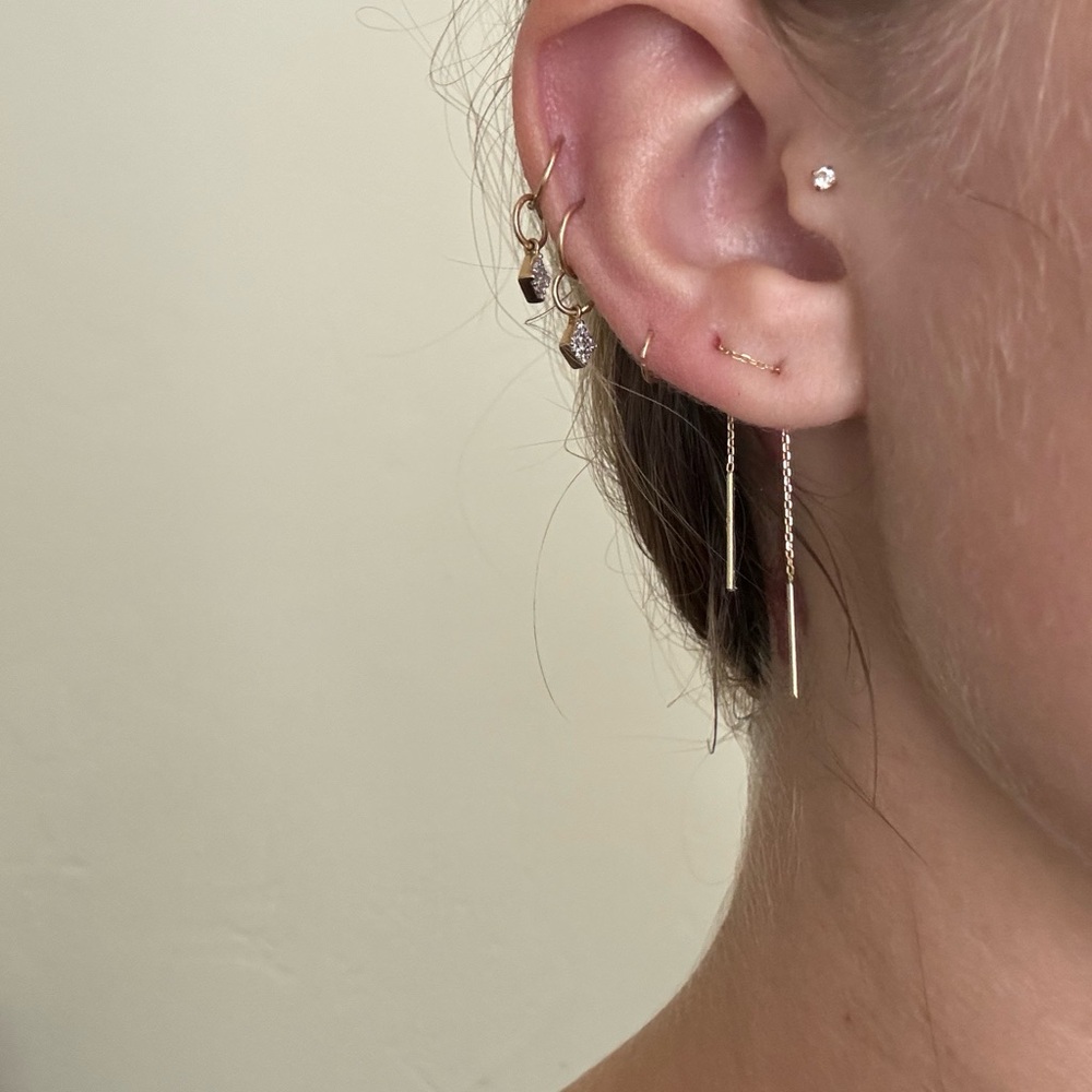 single gold earring